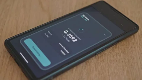 A successful cryptocurrency payment is displayed on the smartphone screen Stock-Footage 337998318