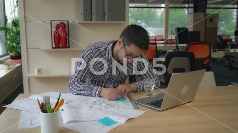Successful designer works in the design agency. Stock Photos