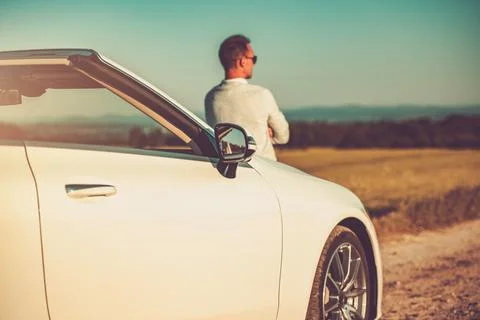 Successful Developer in Front of His Luxury Convertible Thinking About Next.. 写真素材