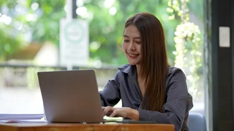 A successful entrepreneur analyzing a technical price graph and indicator with Stock Footage 212888653