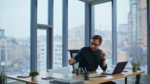Successful executive drinking tea at luxury office. Smiling man sipping coffee Stock Footage 340294787
