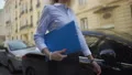 Successful female employee of audit firm going to check documentation of company 4k or 4k+ Resolution