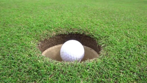 A successful golf put in slow motion Stock Footage 77676126
