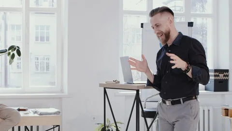 Successful happy middle aged CEO businessman speaking, answering questions at Stock Footage 114601966