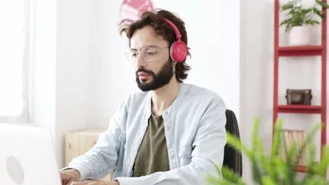 Successful hipster freelancer working on computer while staying at home Stock Footage 182487684