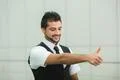 The successful indian businessman show thumb up and look Photo
