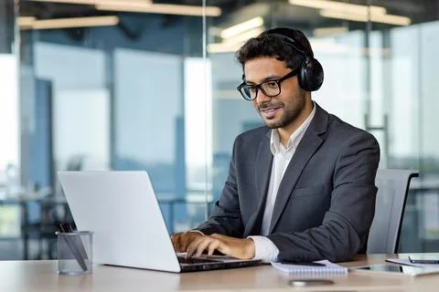 Successful indian programmer working inside office with laptop, man in Stock Photos