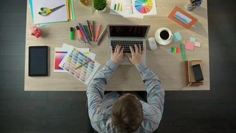 Successful male designer finishing project in time, leaving office to have rest Stock Footage