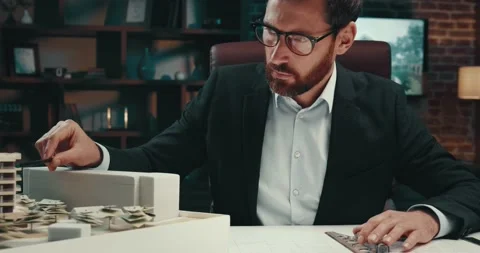 Successful man checking the layout of a ... | Stock Video | Pond5