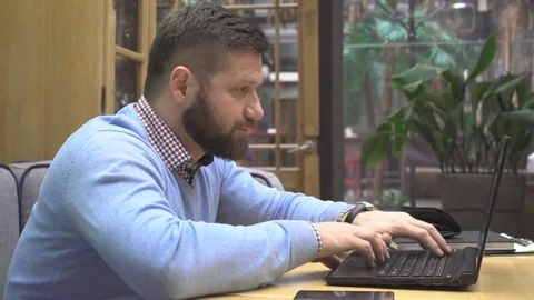 Successful man get good information on laptop, smiling, happy, close steadicam Vidéo 73075810