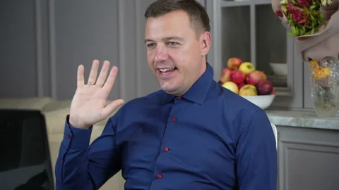 Successful man looking on laptop while working at home office Stock Footage 167774655