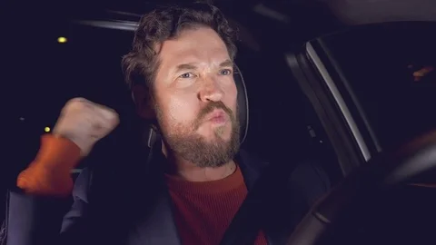 Successful man saying yes driving car at night retro style Stock Footage 76004580