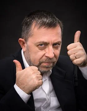 Successful man shows ok sigh Stock Photos