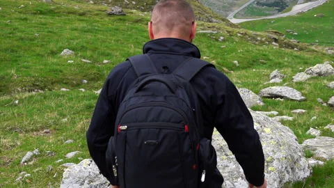 Successful man standing in the mountains, super slow motion Stock Footage 140220121
