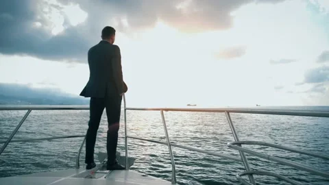 Successful man in a suit sailing on a ya... | Stock Video | Pond5