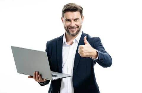 Successful man in suit using laptop in studio. Executive businessman working 库存照片