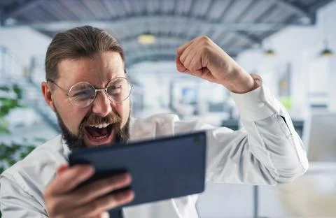 Successful man with tablet Stock Photos