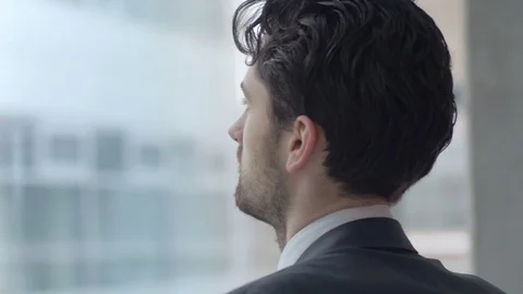 Successful man thinking about new ideas while looking through the window Stock Footage 75550378