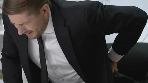 Successful manager ending workday, feeling lower back pain, sedentary lifestyle Stock-Footage 117380147