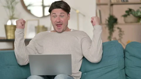 Successful Middle Aged Man Celebrating on Laptop , at Home Stock Footage 142374437