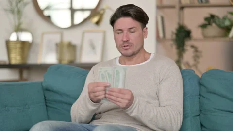 Successful Middle Aged Man Counting Dollars at Home 스톡 동영상 142374242