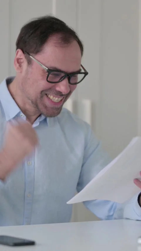 Successful Middle Aged Man Reading Documents, Vertical Video 스톡 동영상 339585159