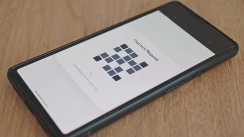 A successful QR code payment is displayed on the smartphone screen Vídeo Stock 337998799