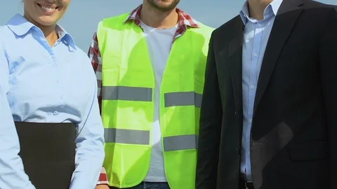 Successful team of architect, engineer and builder gesturing thumbs-up, service Stock-Footage 117195532