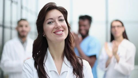 Successful team of different doctors clapping hands 動画素材 237646311