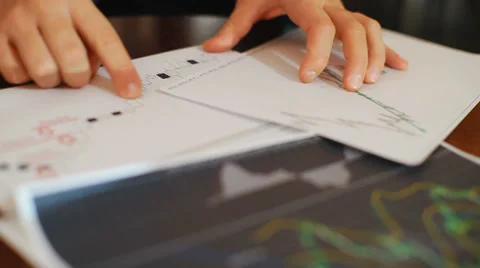 A successful trader explains the graphs principle of trade on the exchange Stock Footage 30892704