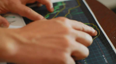 A successful trader explains the graphs principle of trade on the exchange Stock Footage 30893452