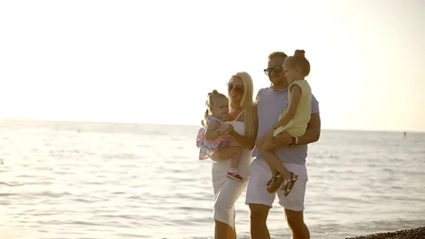 Successful wealthy family resting at the vacation at the seaside with young Stock Footage