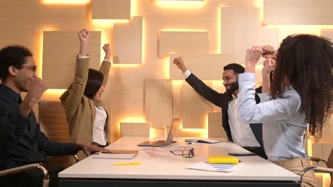 Successful young creative multiracial team celebrate good deal at the office Stock Footage 186078875