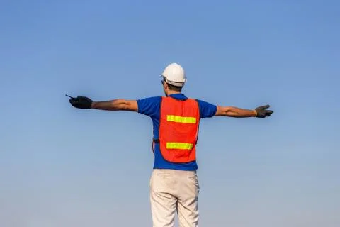 Successful young man with arms wide open, Happy engineer / foreman in hardhat Fotos Stock