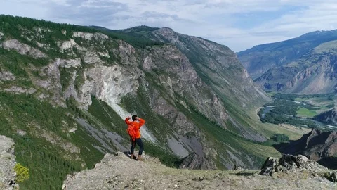 Successful Young Man Reaching The Top aerial slow motion 4k Stock Footage 77874916