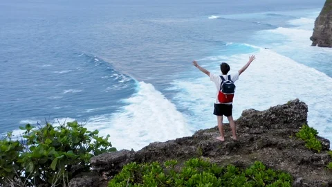 Successful Young Man Silhouette Standing On Ocean Cliff Aerial Raising Arms Stock Footage 121951553