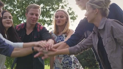 Successful young people together doing team building at sunset. Stockbeeldmateriaal 82870865