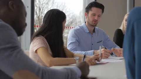 Successful young professional presenting his innovative idea Stock-Footage