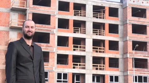 Successful young real estate developer outside apartment building portrait smile Stock Footage 58513797
