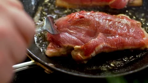 Succulent duck breast seared in a hot frying pan Stock Footage 333876004