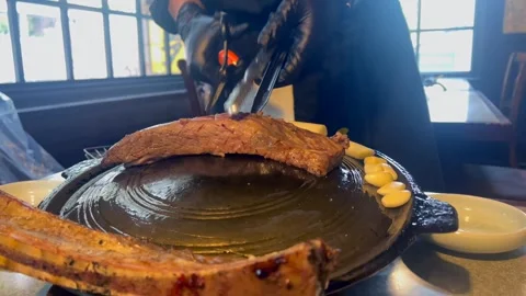 Succulent grilled beef, premium protein source, sizzles on hot BBQ grill Stock Footage 301517200
