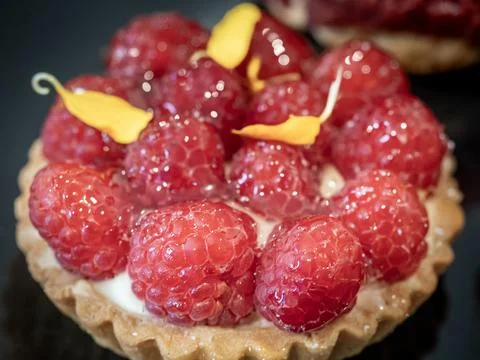 Succulent Raspberry Tart on display Stock Photos