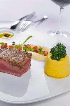 Succulent steak served with condiments Stock Photos