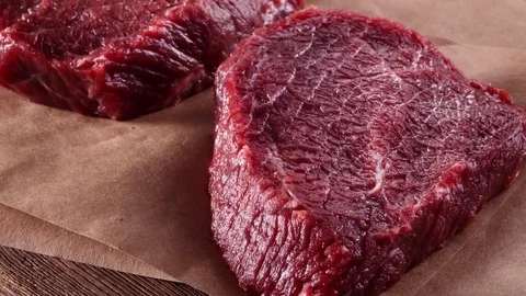 Succulent tender raw lean beef steaks lying Stock Footage 72671706