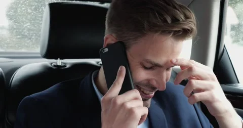 Sucessful Entrepreneur talking on Smartphone while traveling by Car. Stock Footage 140603927