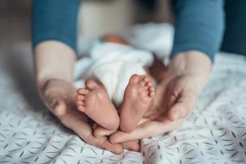 Such tiny feet! Stock Photos