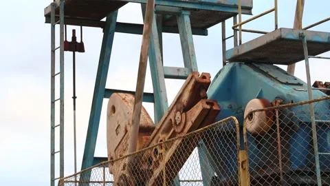 Sucker rod pumps are working and pumping oil. Rotating mechanisms close-up Stock-Footage 149256257