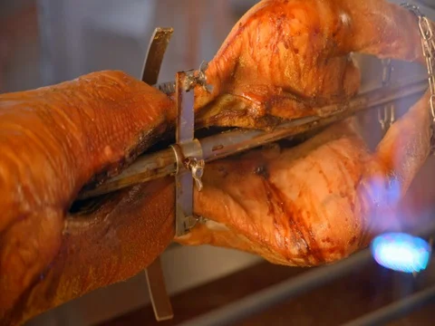 Suckling pig roasted on a spit Stock Footage 75562521