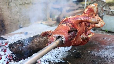 Suckling pig on a spit Stock Footage 78055337