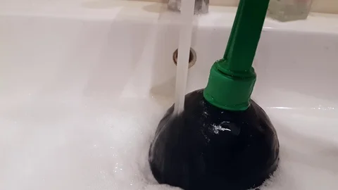 Suction cup clean the sink in the bathroom Stock Footage 89711036